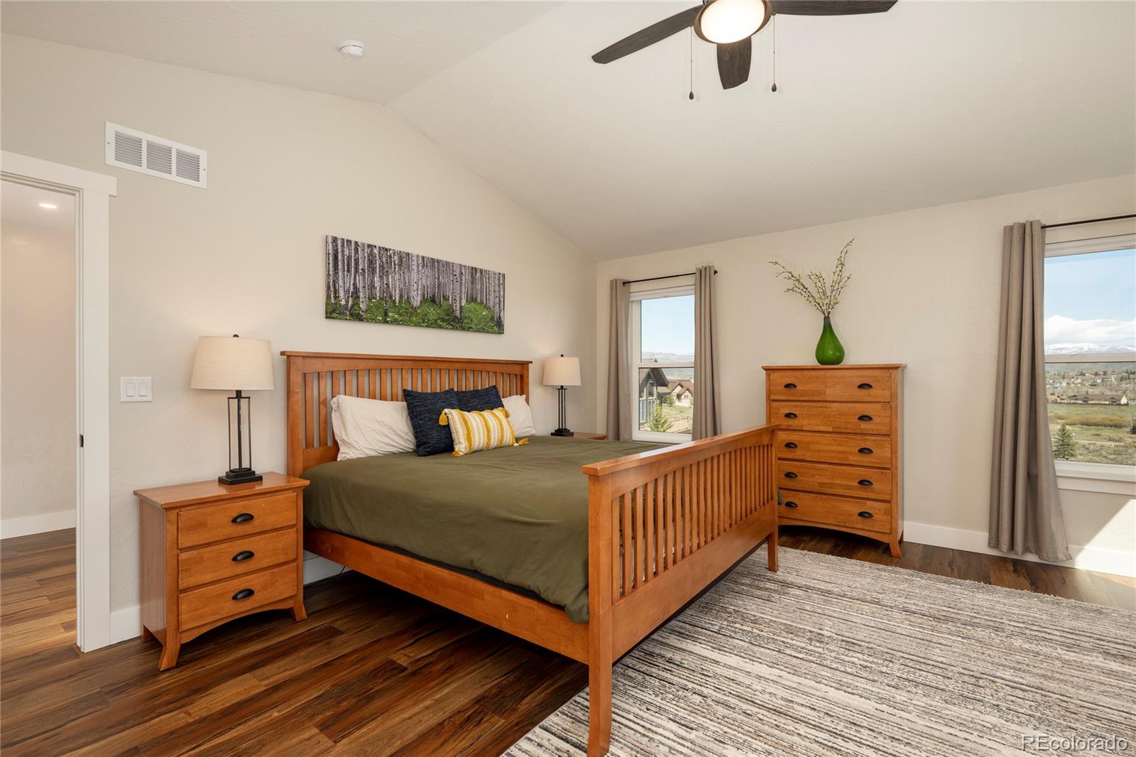 719 Saddle Ridge Circle Granby, CO 80446 - Photo 18 of 47 a bedroom with a bed and wooden floor