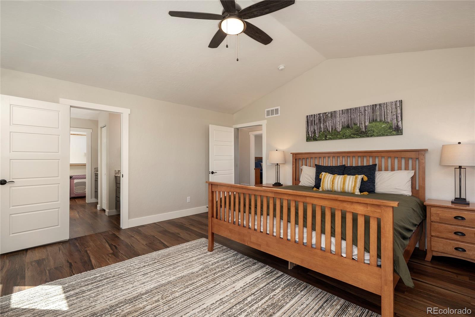 719 Saddle Ridge Circle Granby, CO 80446 - Photo 19 of 47 a view of a bedroom with furniture and wooden floor
