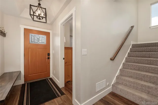 a view of a hallway with front door