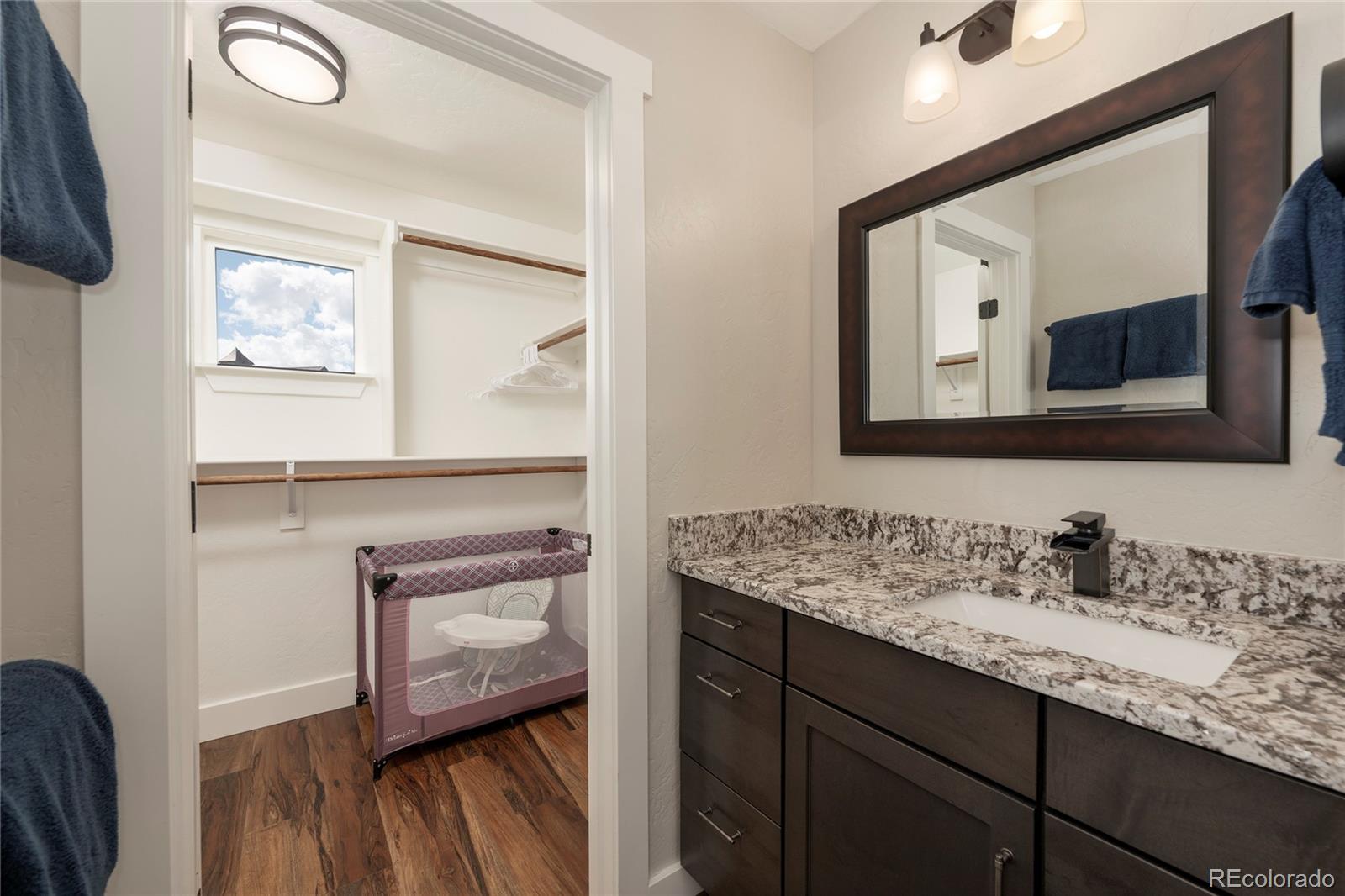 719 Saddle Ridge Circle Granby, CO 80446 - Photo 22 of 47 a bathroom with a sink vanity and mirror