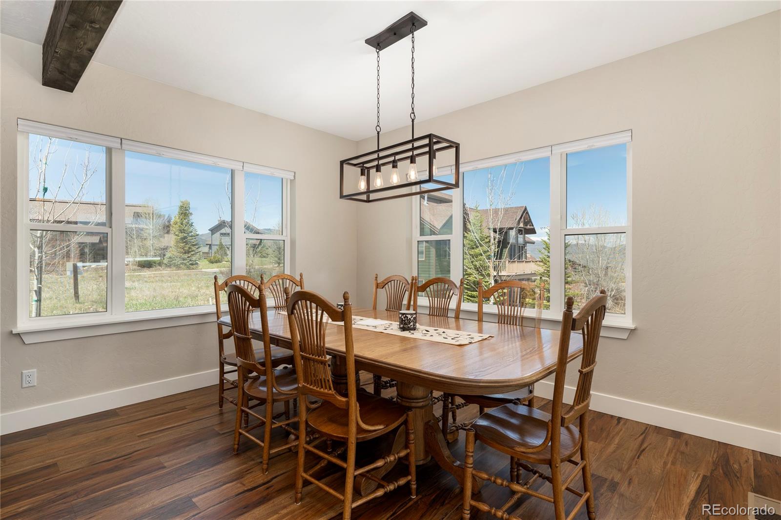719 Saddle Ridge Circle Granby, CO 80446 - Photo 7 of 47 a view of a dining room with furniture window and wooden floor