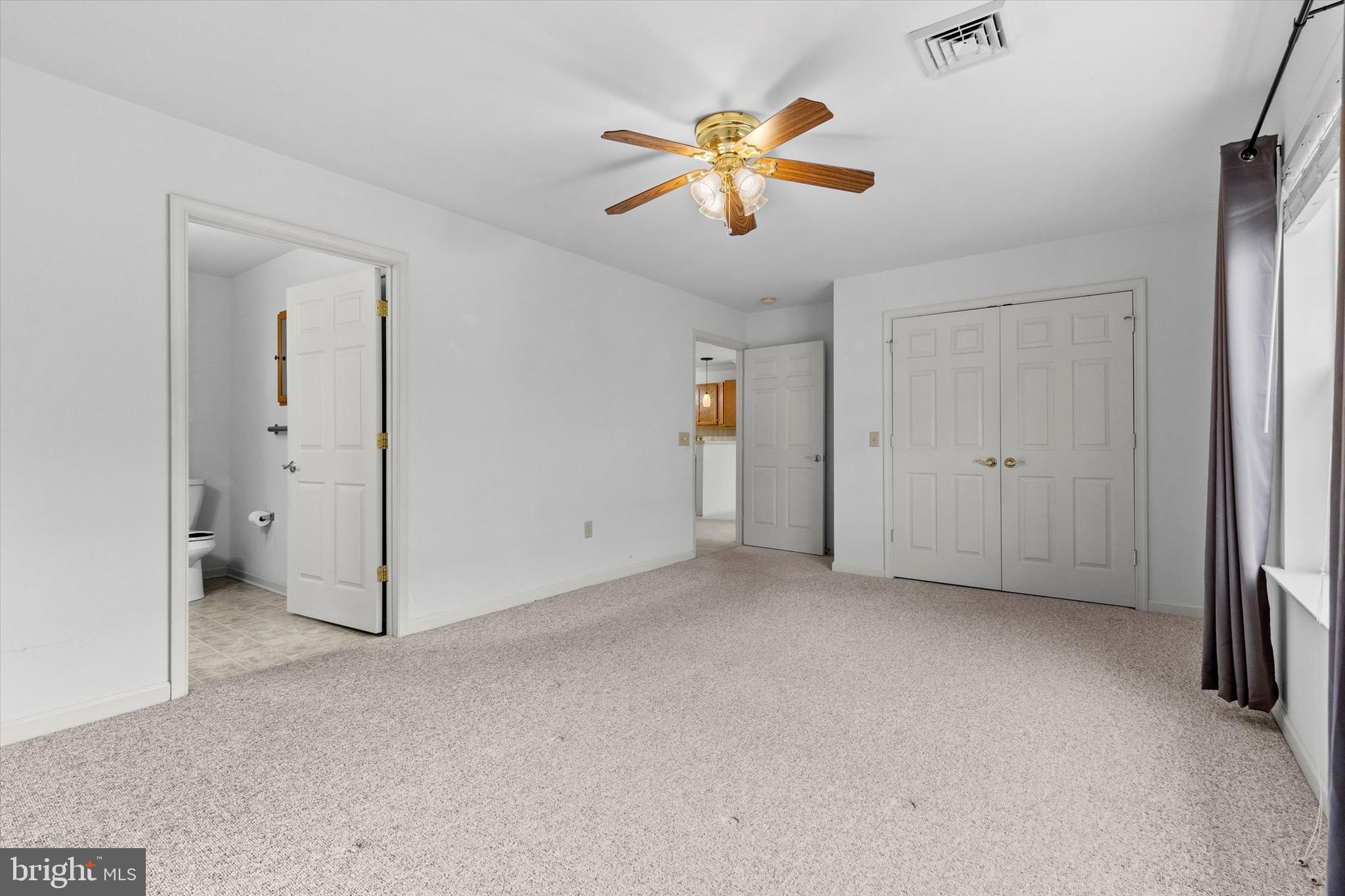 218 Equine Cove Red Lion, PA 17356 - Photo 17 of 24 an empty room with a window and a ceiling fan