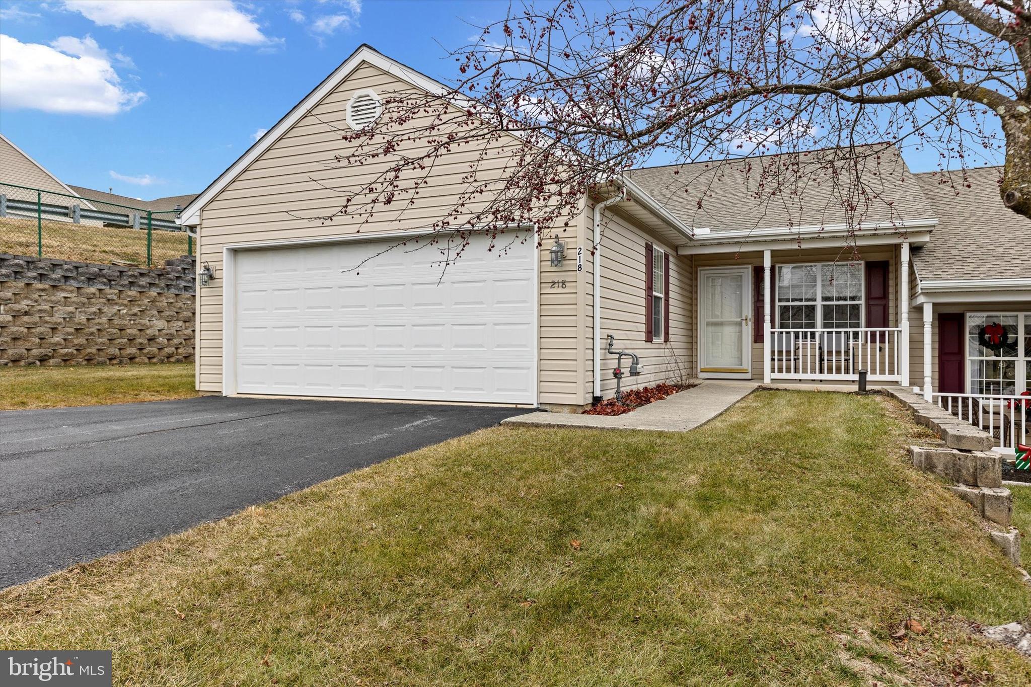 218 Equine Cove Red Lion, PA 17356 - Photo 2 of 24 a view of yellow house with garage and large windows