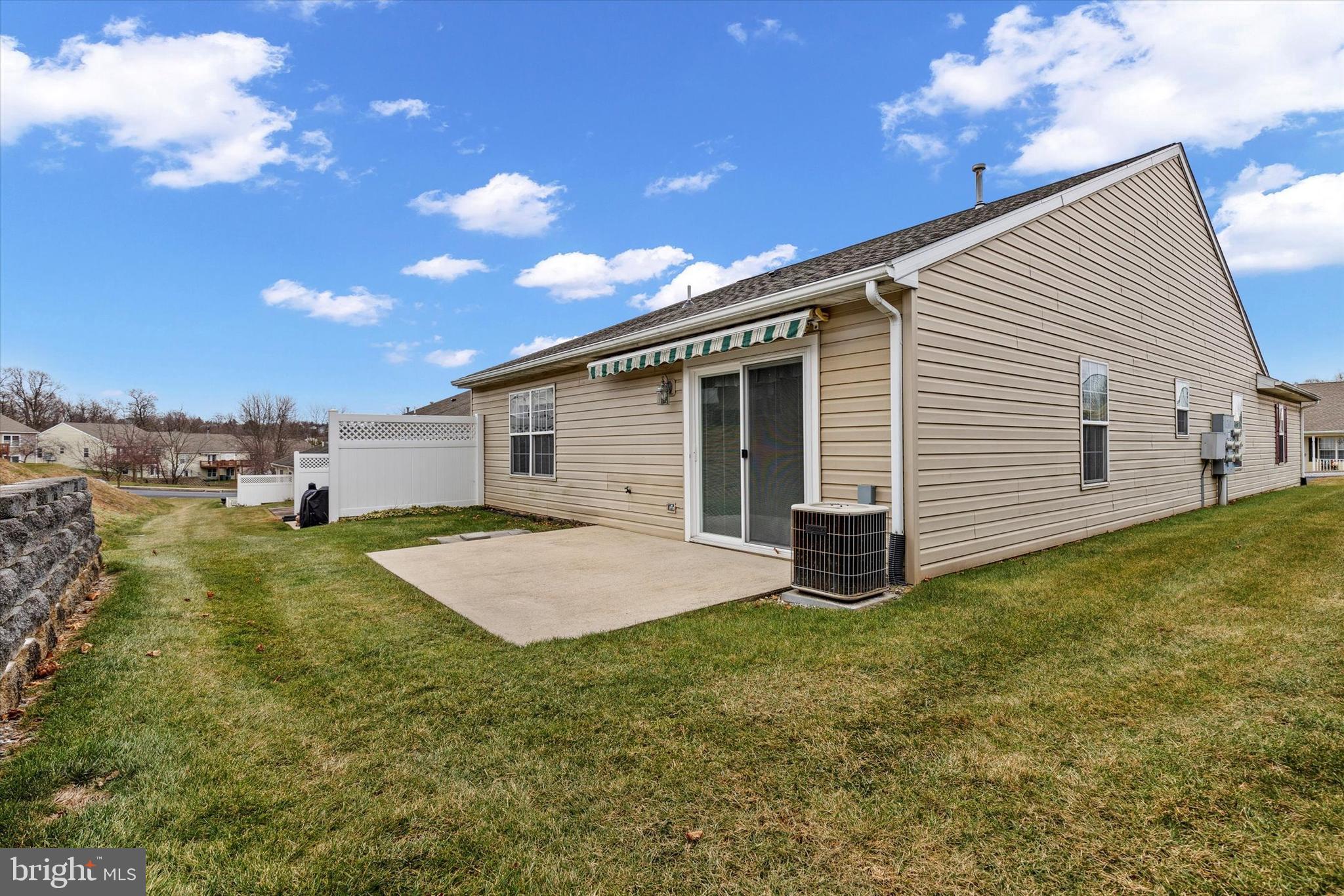 218 Equine Cove Red Lion, PA 17356 - Photo 22 of 24 a backyard of a house with plants and outdoor seating