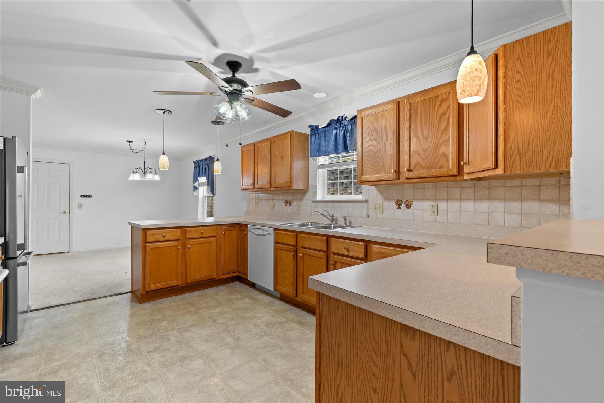 218 Equine Cove Red Lion, PA 17356 - Photo 10 of 24 a kitchen with stainless steel appliances granite countertop a sink a stove cabinets counter space and a window