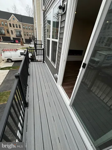 a balcony with view of an outdoor space