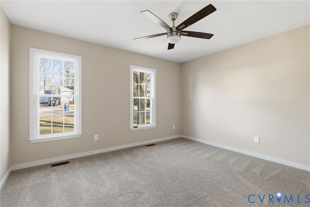 8736 Sunset Knoll Road Richmond, VA 23237 - Photo 14 of 26 an empty room with a window