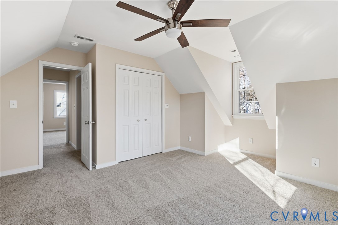 8736 Sunset Knoll Road Richmond, VA 23237 - Photo 18 of 26 a view of an empty room and a ceiling fan