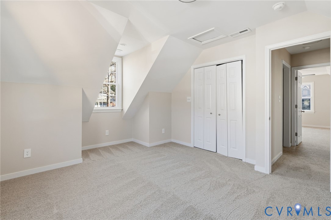 8736 Sunset Knoll Road Richmond, VA 23237 - Photo 20 of 26 an empty room with windows