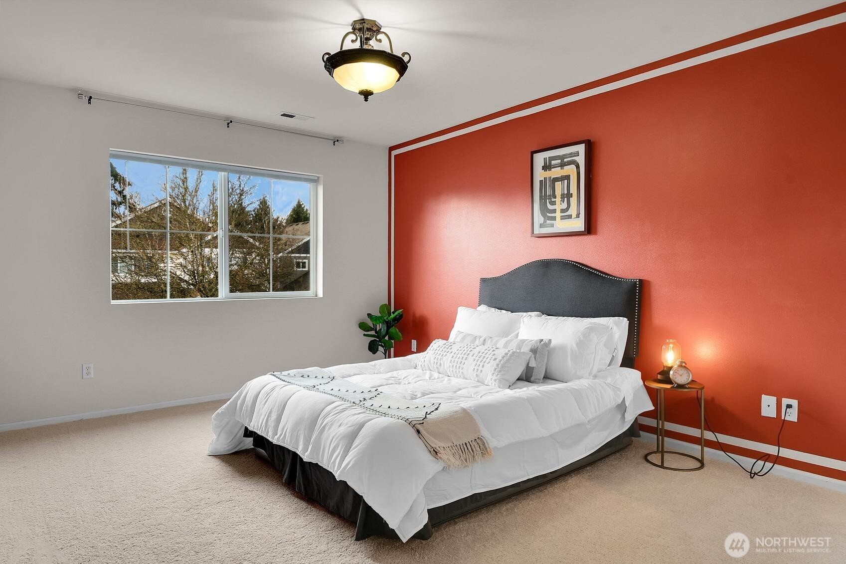 3259 Destination Avenue East Fife, WA 98424 - Photo 11 of 33 a bedroom with a bed and a lamp next to a window