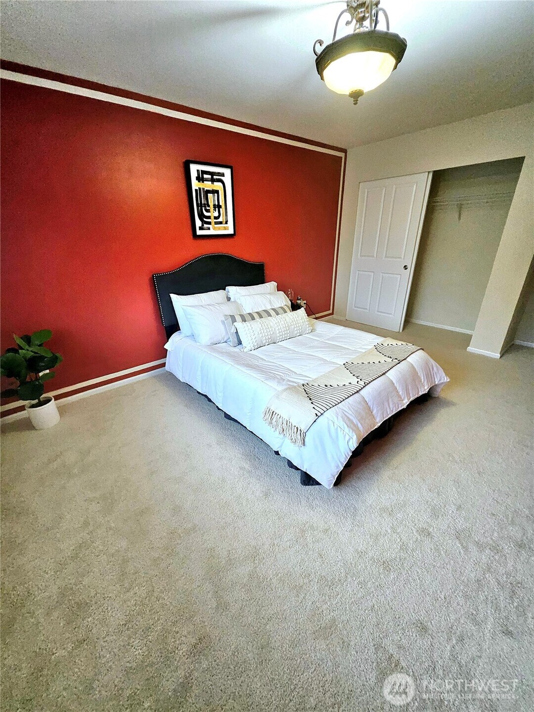3259 Destination Avenue East Fife, WA 98424 - Photo 12 of 33 a spacious bedroom with a bed and a dresser in it