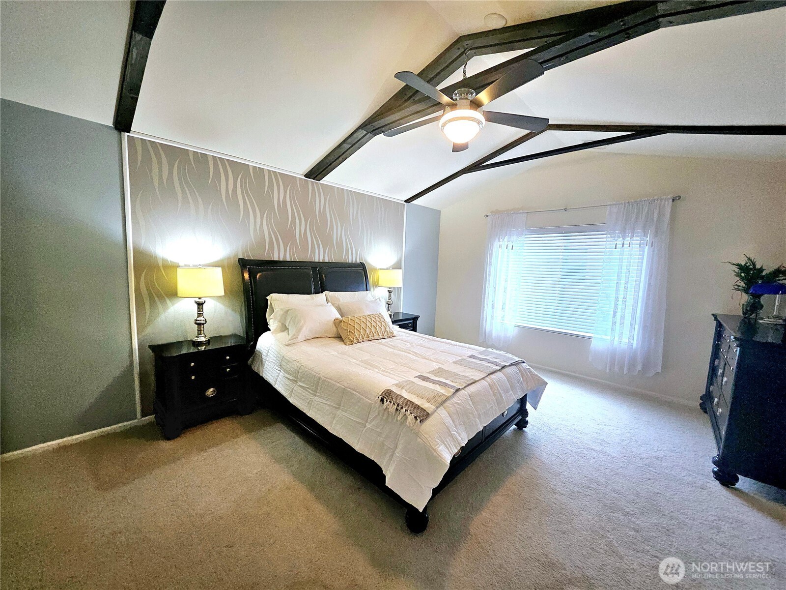 3259 Destination Avenue East Fife, WA 98424 - Photo 17 of 33 a spacious bedroom with a bed and a mirror