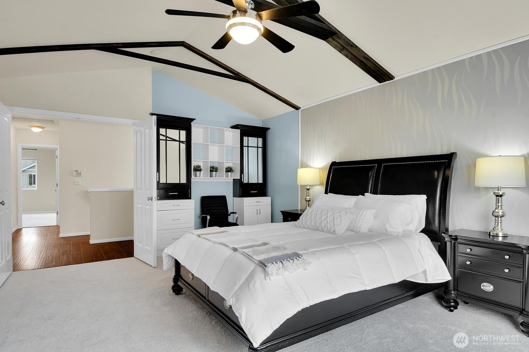 3259 Destination Avenue East Fife, WA 98424 - Photo 18 of 33 a bedroom with a large bed and a chandelier