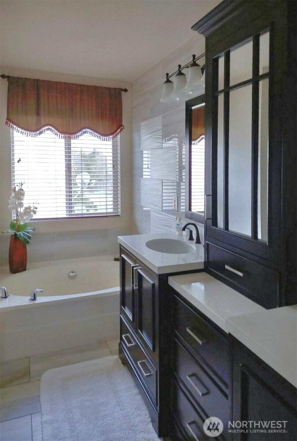 3259 Destination Avenue East Fife, WA 98424 - Photo 21 of 33 a bathroom with a tub double sink window and mirror