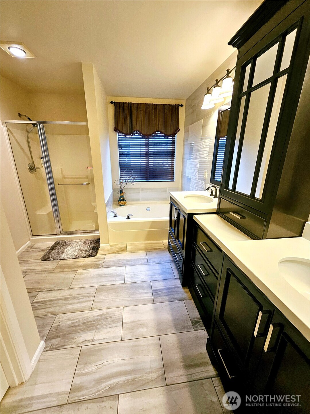 3259 Destination Avenue East Fife, WA 98424 - Photo 24 of 33 a bathroom with a sink a mirror and a bathtub