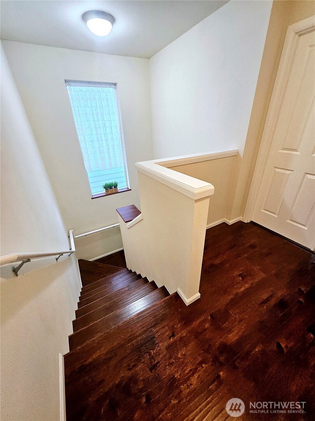 3259 Destination Avenue East Fife, WA 98424 - Photo 29 of 33 a view of an empty room with wooden floor and a window