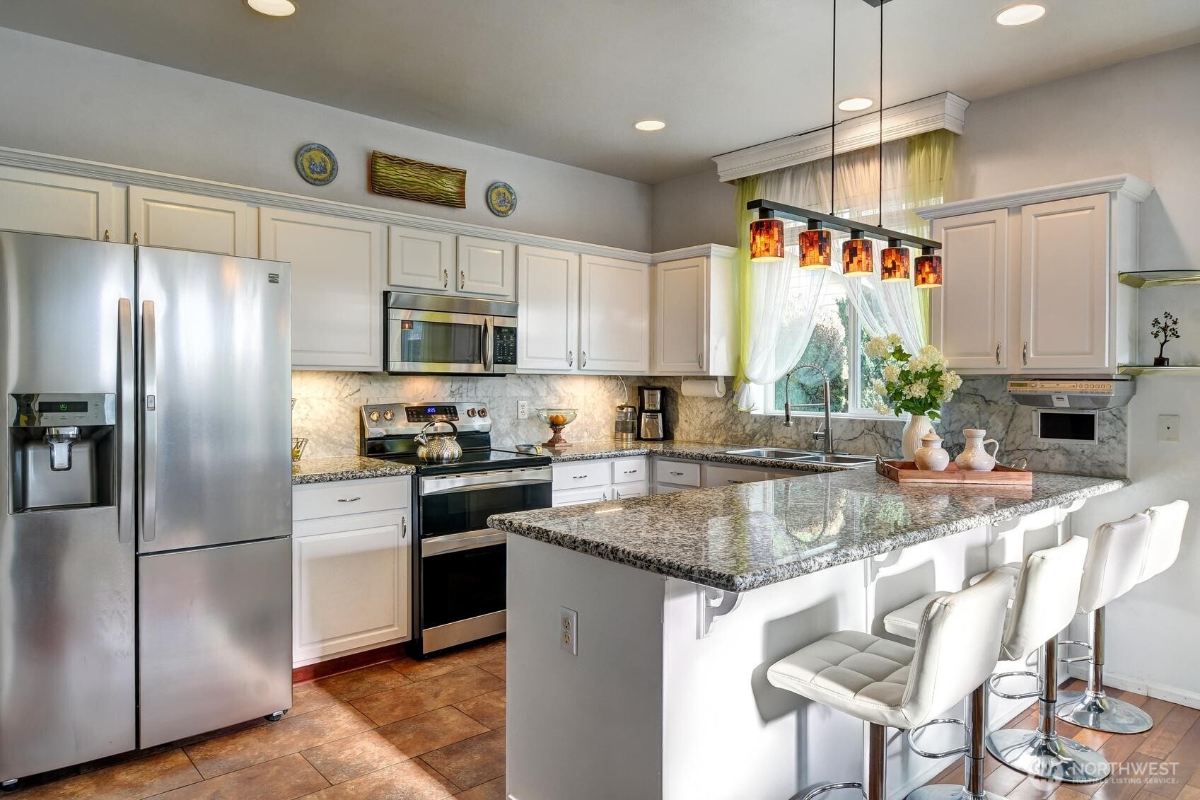 3259 Destination Avenue East Fife, WA 98424 - Photo 3 of 33 a kitchen with stainless steel appliances granite countertop a sink a stove a refrigerator and island