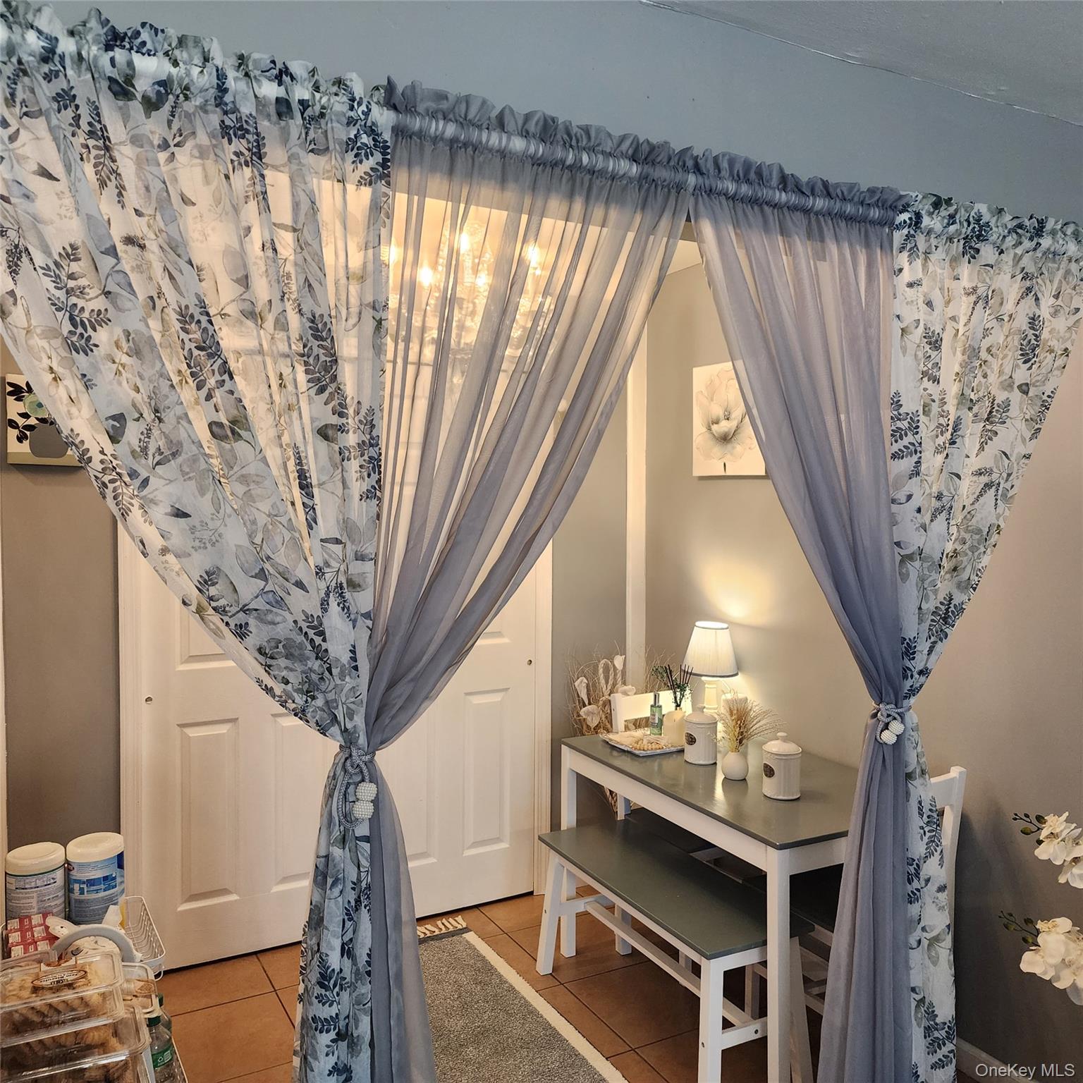 2 D Valley Forge Court Ridge, NY 11961 - Photo 3 of 13 a very nice looking room with a large window and a chandelier