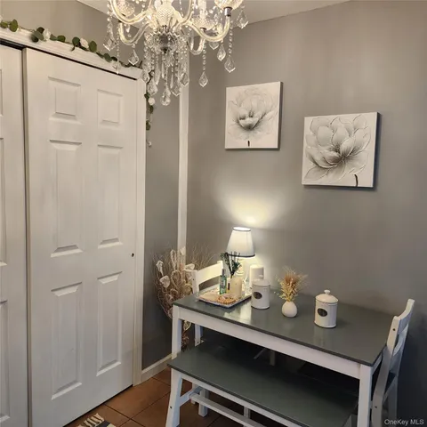 a view of a workspace with furniture and wooden floor