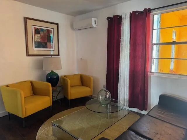 a living room with furniture and a window