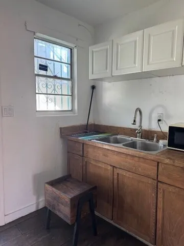 a room with two sink and a window