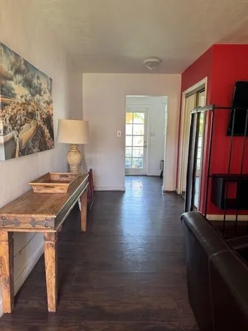 a kitchen with granite countertop a stove and a refrigerator