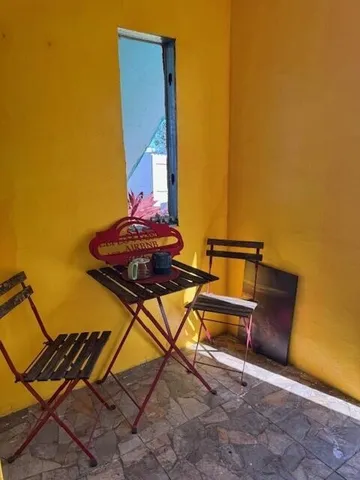 a view of a patio with table and chairs and potted plants