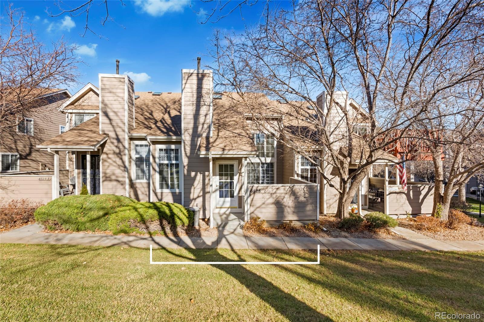 a view of a house with snow on the wall