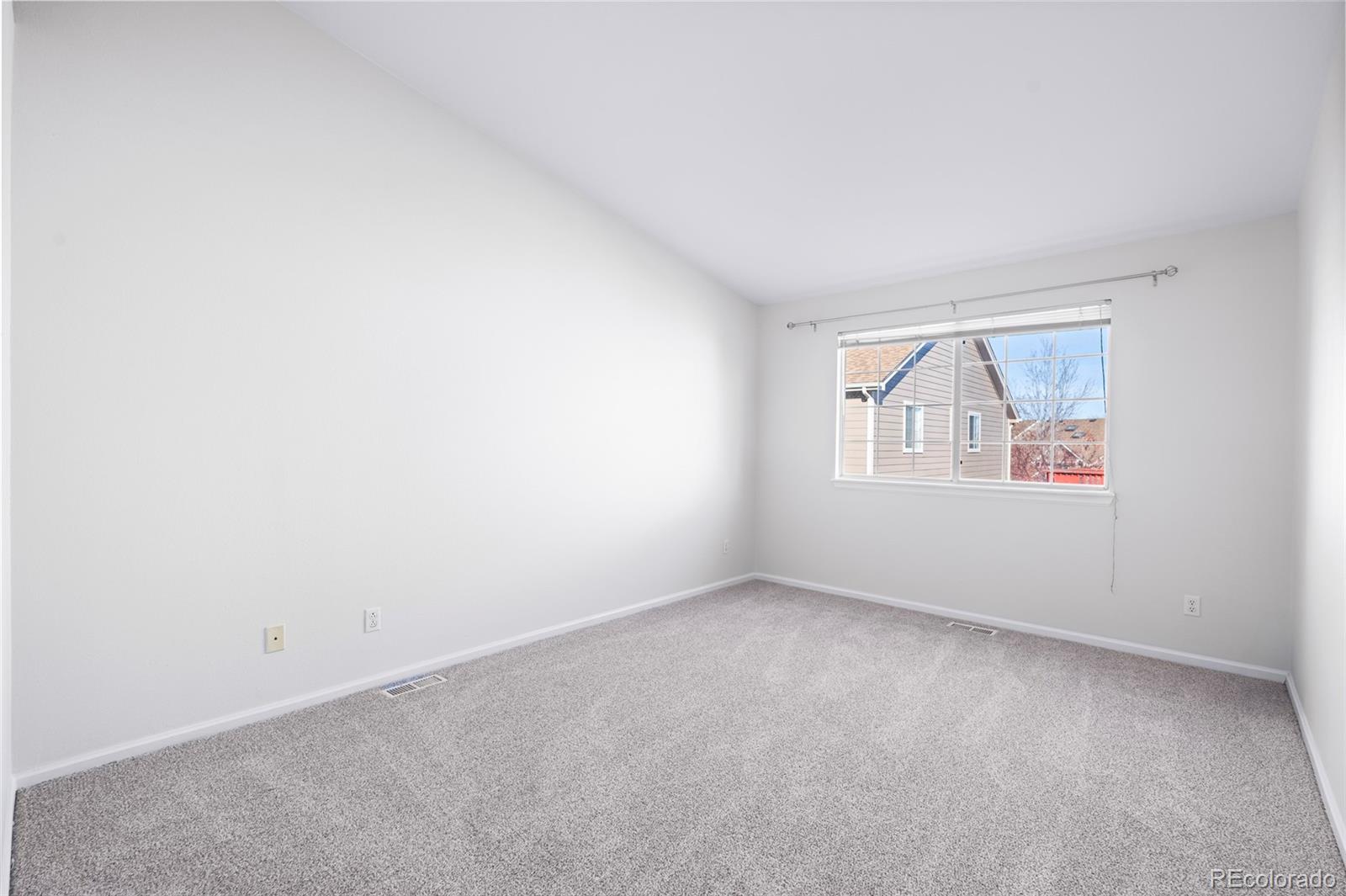 6828 Zenobia Street, Unit 2 Westminster, CO 80030 - Photo 12 of 24 an empty room with windows