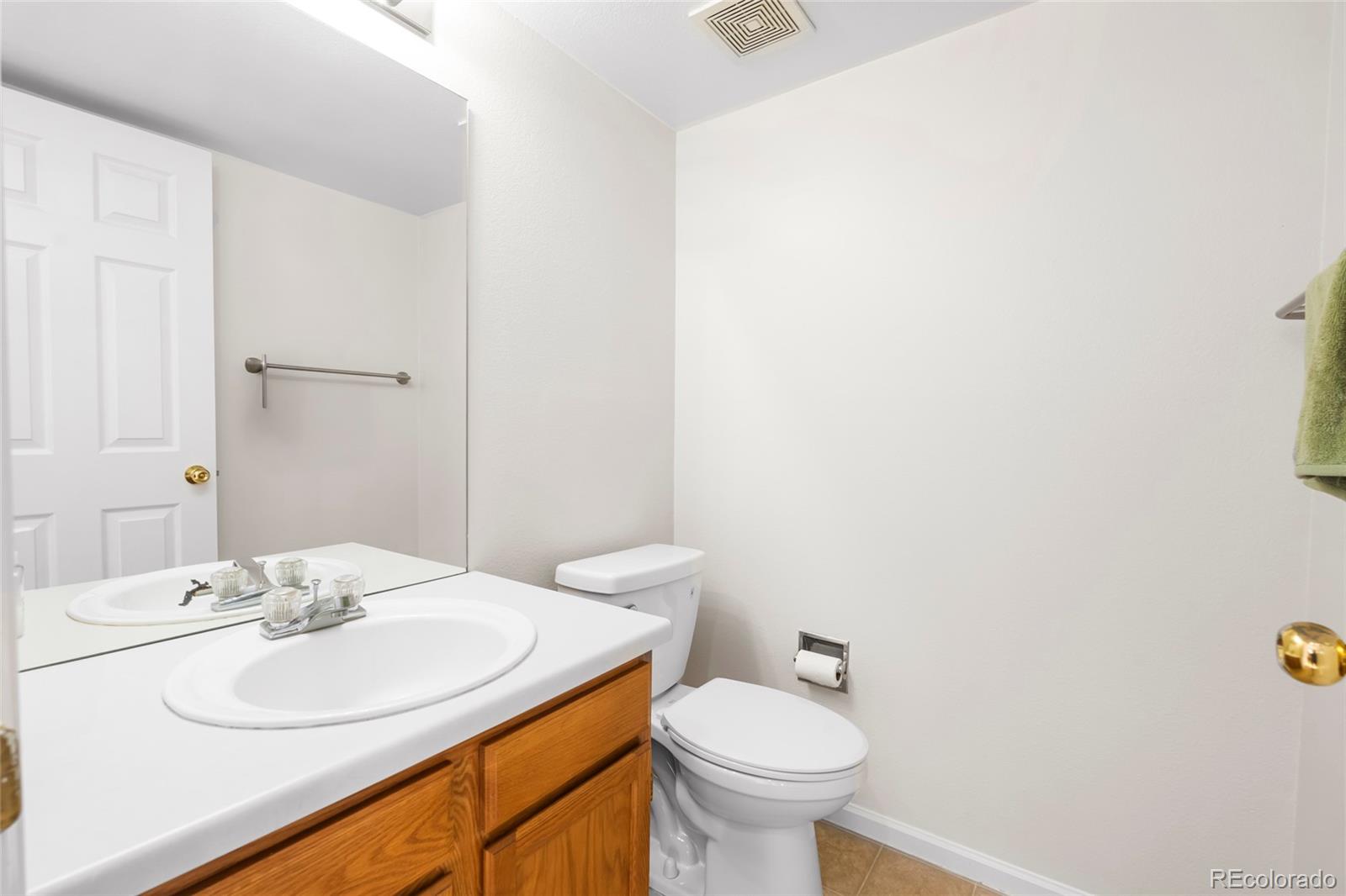 6828 Zenobia Street, Unit 2 Westminster, CO 80030 - Photo 17 of 24 a bathroom with a sink and a toilet