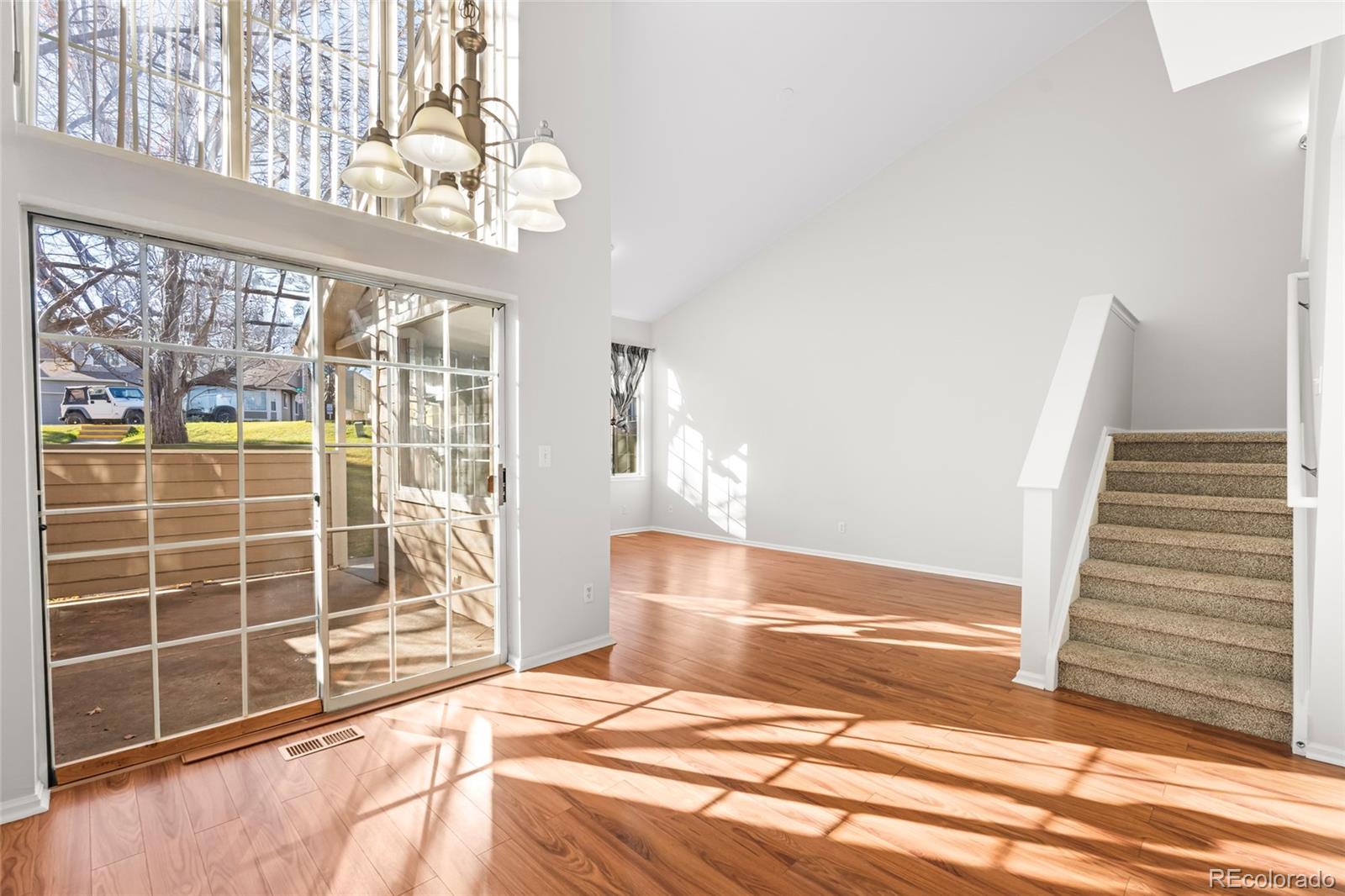 6828 Zenobia Street, Unit 2 Westminster, CO 80030 - Photo 9 of 24 a bedroom with a bed and a window