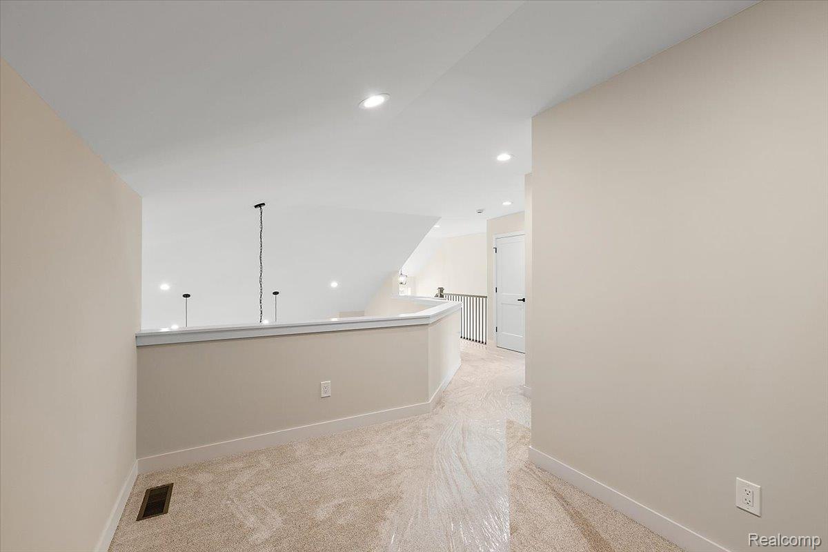 2032 Breckenridge Court, Unit 9 Rochester, MI 48309 - Photo 34 of 39 Corridor with recessed lighting and light colored carpet