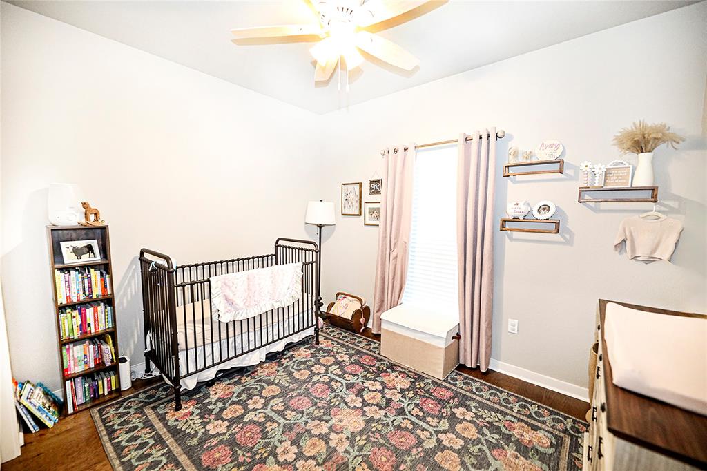 305 Main Street Nocona, TX 76255 - Photo 16 of 36 a view of a hallway with wooden floor and entryway