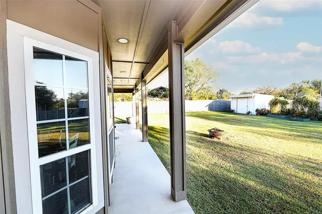 a view of a swimming pool and an outdoor seating