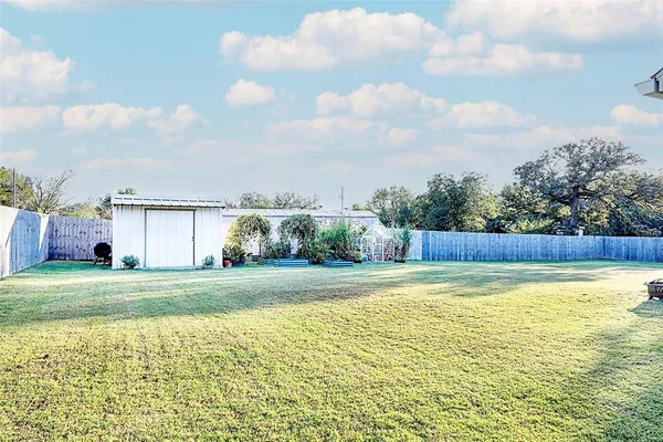 a view of a swimming pool and a yard