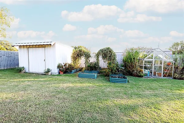 a view of a house with a big yard