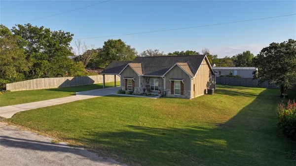 a house with swimming pool in front of it