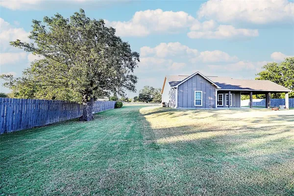 a view of a house with a big yard