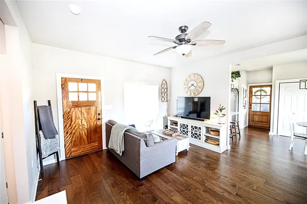 a living room with furniture and a flat screen tv