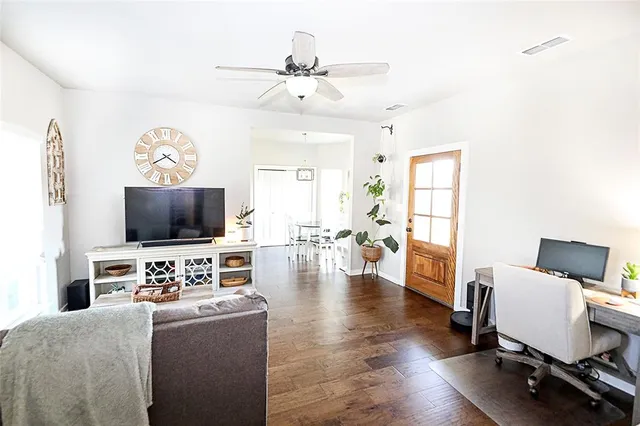a view of a dining room with furniture and wooden floor