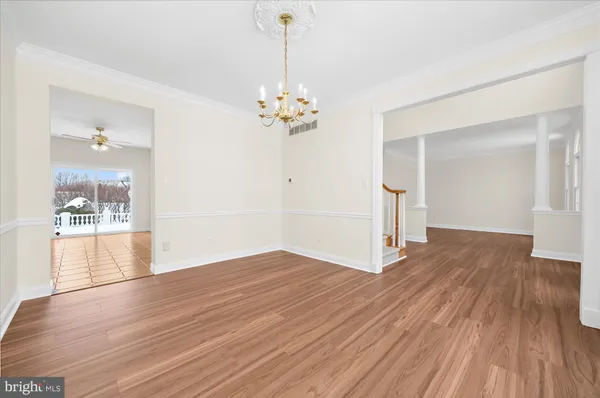 a kitchen with stainless steel appliances granite countertop a stove a sink a microwave a refrigerator and cabinets