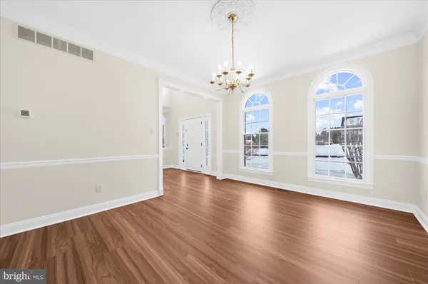 a kitchen with stainless steel appliances granite countertop a sink and a stove