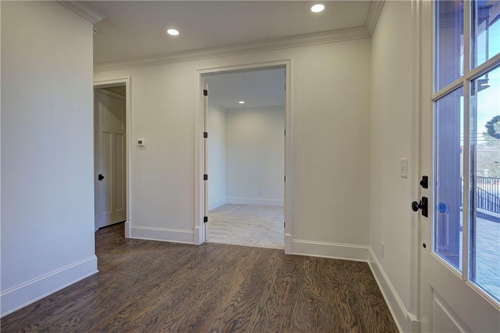 178 West Main Street, Unit 102 Cartersville, GA 30120 - Photo 11 of 50 wooden floor in an empty room with a window