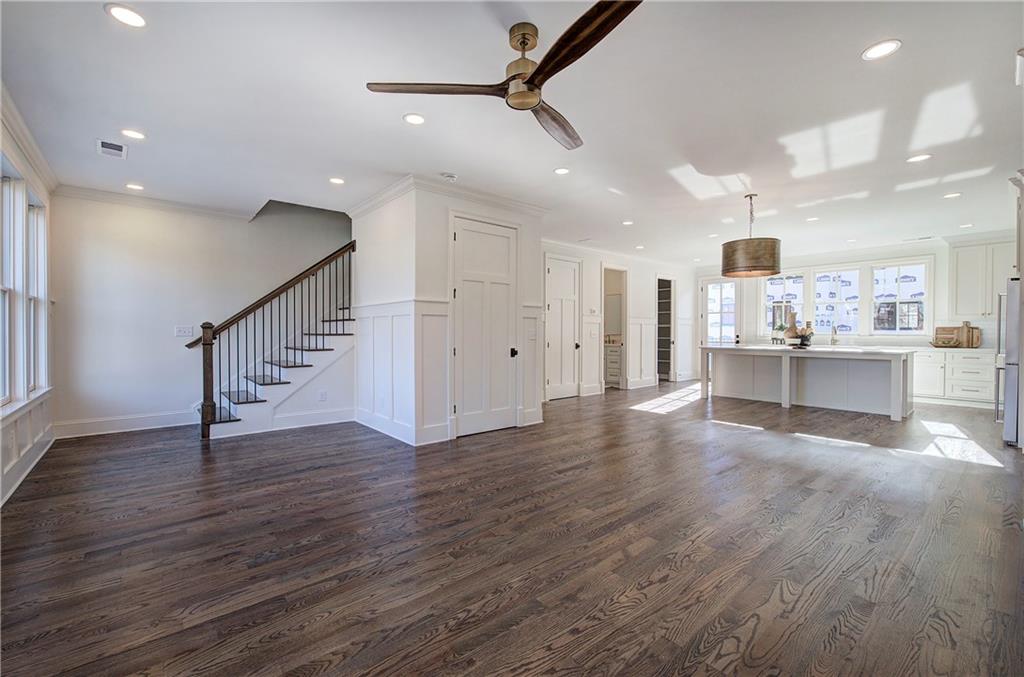 178 West Main Street, Unit 102 Cartersville, GA 30120 - Photo 13 of 50 a view of an empty room with wooden floor and a kitchen