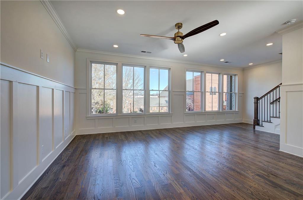 178 West Main Street, Unit 102 Cartersville, GA 30120 - Photo 15 of 50 an empty room with wooden floor fan and windows