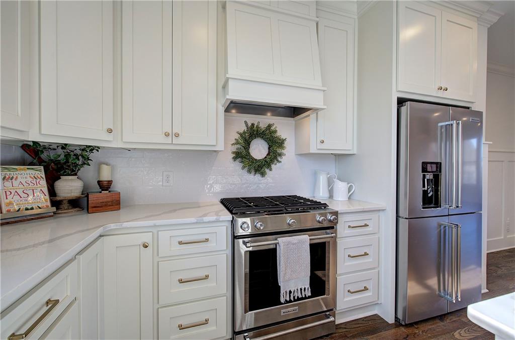 178 West Main Street, Unit 102 Cartersville, GA 30120 - Photo 19 of 50 a kitchen with white cabinets and stainless steel appliances