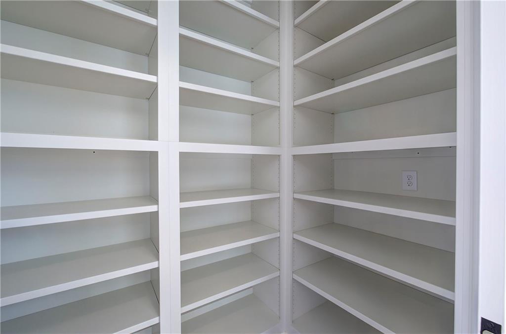 178 West Main Street, Unit 102 Cartersville, GA 30120 - Photo 22 of 50 a view of walk in closet with empty racks