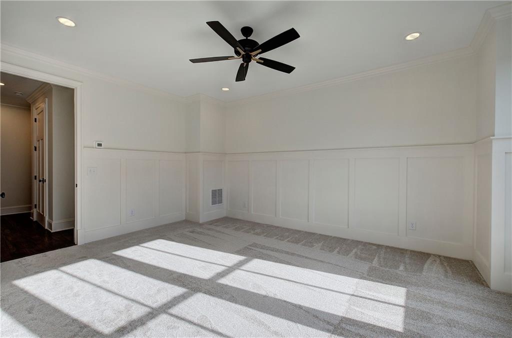 178 West Main Street, Unit 102 Cartersville, GA 30120 - Photo 25 of 50 an empty room with closet and ceiling fan