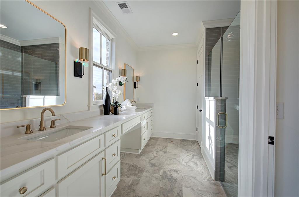 178 West Main Street, Unit 102 Cartersville, GA 30120 - Photo 26 of 50 a spacious bathroom with a double vanity sink mirror and shower