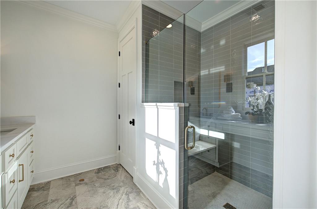 178 West Main Street, Unit 102 Cartersville, GA 30120 - Photo 27 of 50 a bathroom with a glass shower door and a sink